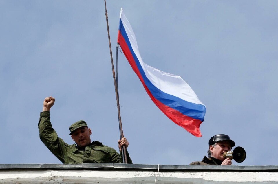 Russiske flagg vaier over marinebasen i Sevostopol på Krimhalvøya 19. mars 2014. To dager senere signerer president Putin loven der han formelt annekterer Krim-halvøya. Foto: Reuters / Vasily Fedosenko